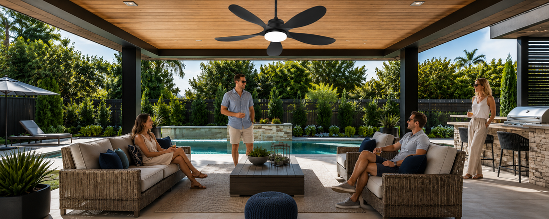 Black solar ceiling fan with light over a shaded poolside covered patio