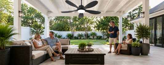 Black solar ceiling fan with light installed under a covered pergola for no-wiring outdoor cooling and evening comfort