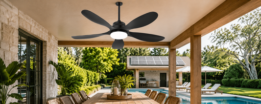 Solar fan light installed on a covered patio with nearby solar panels for outdoor airflow and lighting
