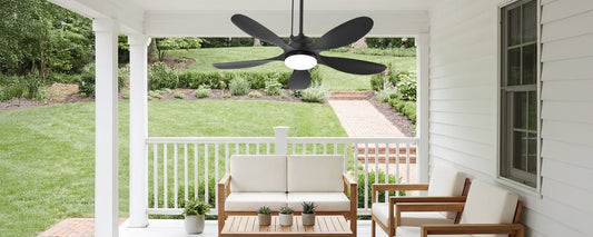 Solar ceiling fan with light installed under a covered patio roof
