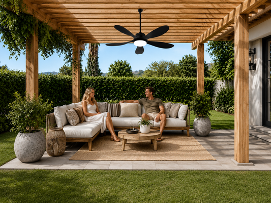Outdoor solar ceiling fan with light installed under a covered patio for backyard seating