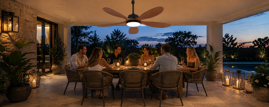 Solar ceiling fan with light running at night over a covered patio dining area
