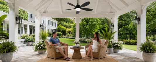 Black gazebo fan and light installed in a white covered backyard gazebo