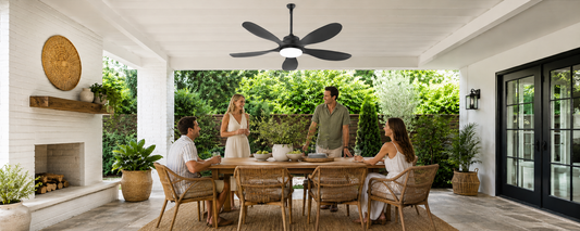 Outdoor ceiling fan with light installed over a covered patio dining area