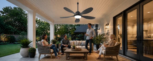 Solar ceiling fan with light over a covered patio seating area at night