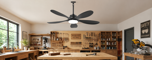 Solar ceiling fan with light installed in a workshop for airflow and task lighting