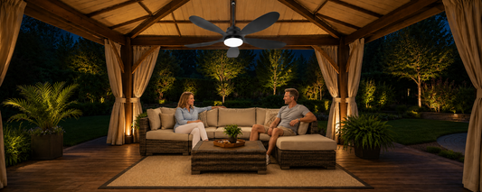 Solar ceiling fan with light running at night in a covered gazebo seating area