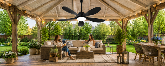 Outdoor solar fan with light installed under a pergola for backyard airflow and evening lighting