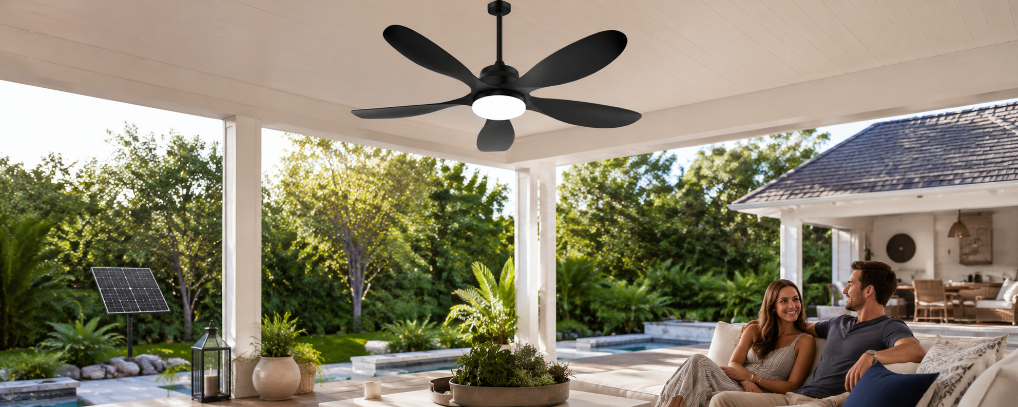 Covered patio with black solar ceiling fan with light and battery backup for outdoor seating area