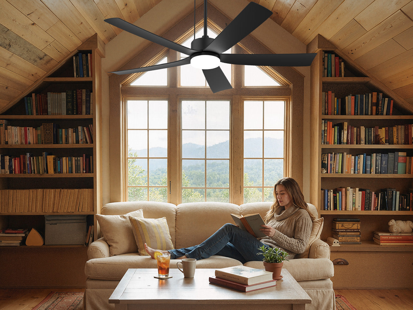 52 inch ceiling fan with light installed on a sloped wood ceiling