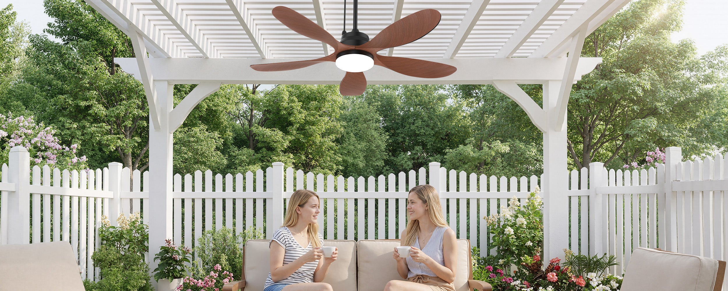 Outdoor patio with Ventallion solar ceiling fan and light installed under a pergola