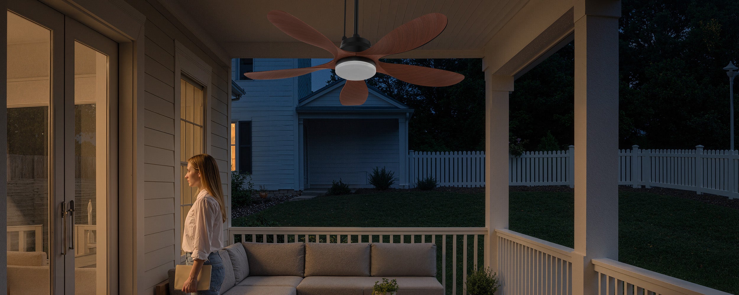 solar ceiling fan with light on a covered patio at night