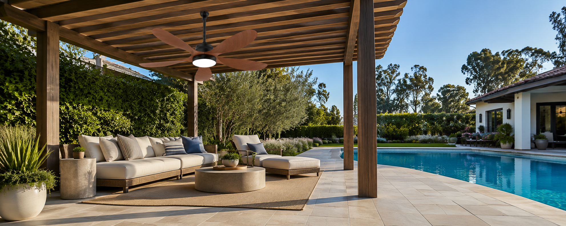 Solar fan-light fixture with accent string lights over an evening pergola seating area