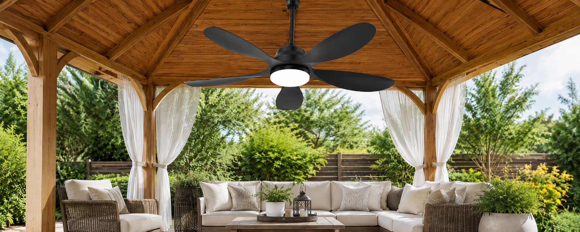 Solar ceiling fan with integrated light mounted above a pergola dining table with safe blade clearance